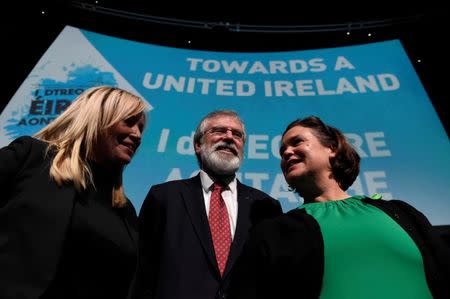 Sinn Fein's Michelle O'Neill (L), Gerry Adams and Mary Lou McDonald pose for a picture at a Sinn Fein conference on Irish Unity in Dublin, Ireland January 21, 2017. REUTERS/Clodagh Kilcoyne