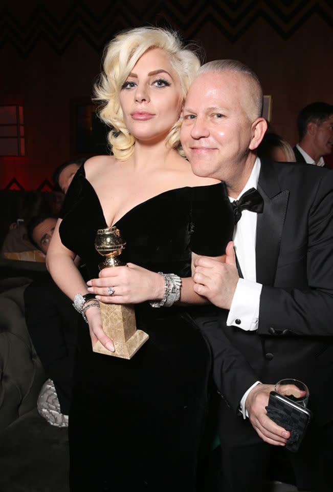 Ryan Murphy put a proud chin on his “American Horror Story: Hotel” star’s shoulder after Lady Gaga picked up the gong for Best Performance by an Actress in a Limited Series. (Photo: Getty Images)