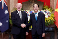 FILE PHOTO: Australia's Governor-General Peter Cosgrove shakes hands with Vietnam's President Tran Dai Quang at the Presidential Palace in Hanoi, Vietnam May 24, 2018. Luong Thai Linh/Pool via REUTERS/FiIe Photo