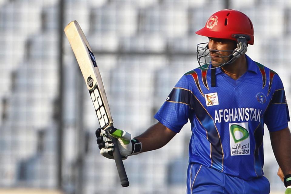 Afghanistan’s Samiullah Shenwari acknowledges the crowd after scoring fifty runs during their match against India in the Asia Cup one-day international cricket tournament in Dhaka, Bangladesh, Wednesday, March 5, 2014. (AP Photo/A.M. Ahad)