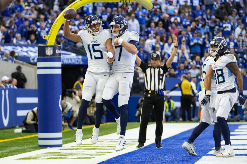 Tennessee Titans wide receiver Nick Westbrook-Ikhine (15) celebrates a touchdown catch with quarterback Ryan Tannehill (17) in the second half of an NFL football game against the Indianapolis Colts in Indianapolis, Sunday, Oct. 31, 2021. (AP Photo/AJ Mast)