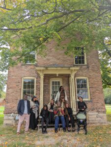 Group photo in front of Harriet Tubman's home