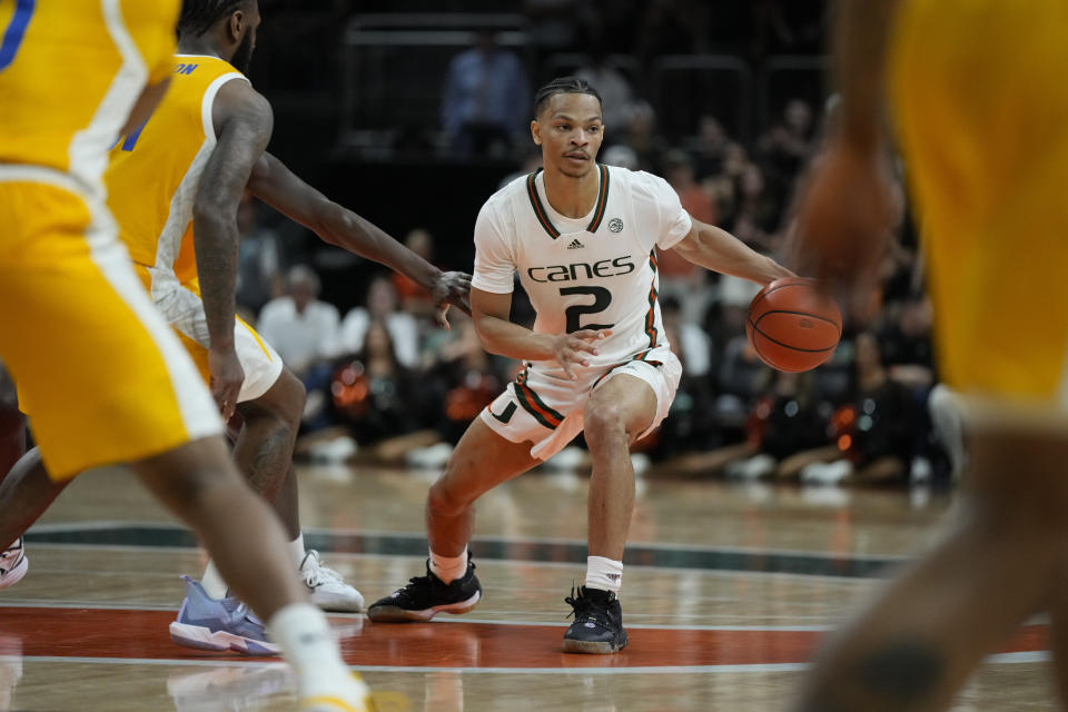 Miami guard Isaiah Wong (2) looks for his next move during the second half of the team's NCAA college basketball game against Pittsburgh, Saturday, March 4, 2023, in Coral Gables, Fla. (AP Photo/Rebecca Blackwell)
