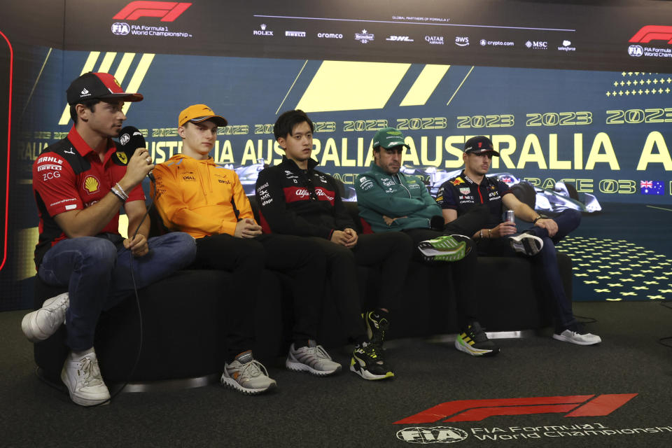 Ferrari driver Charles Leclerc of Monaco, left, McLaren driver Oscar Piastri of Australia, second left, AlphaTauri driver Yuki Tsunoda of Japan, Aston Martin driver Fernando Alonso of Spain, second right and Red Bull driver Max Verstappen of the Netherlands, right, attend a press conference ahead of the Australian Formula One Grand Prix at Albert Park in Melbourne, Thursday, March 30, 2023. (AP Photo/Asanka Brendon Ratnayake)