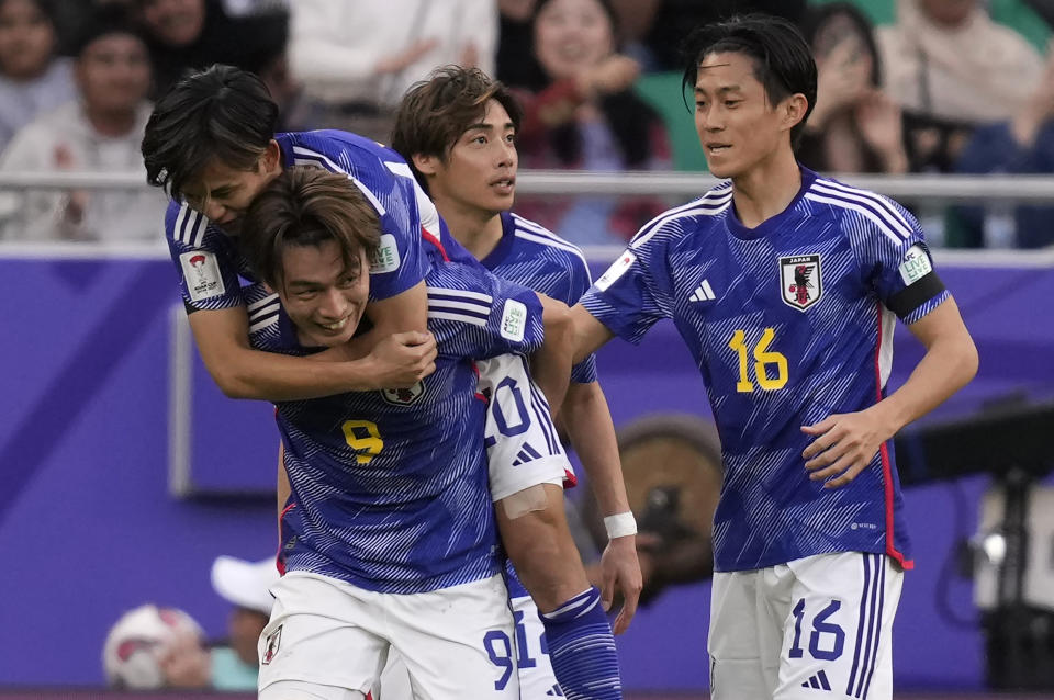 Japan's Ayase Ueda, second left, celebrates with teammates after scoring his side's fourth goal during the Asian Cup Group D soccer match between Japan and Vietnam at Al Thumama Stadium in Doha, Qatar, Sunday, Jan. 14, 2024. (AP Photo/Thanassis Stavrakis)