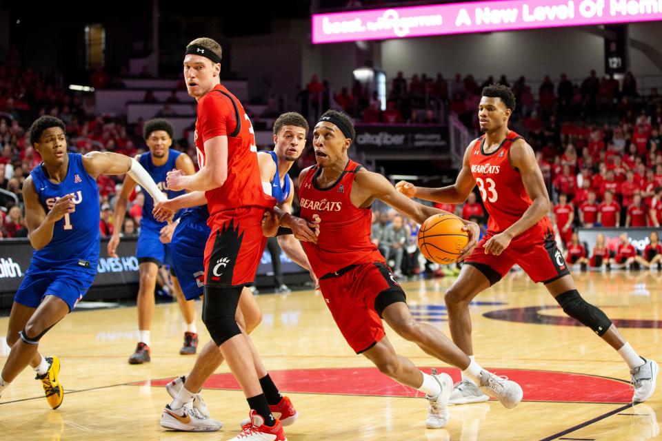 Cincinnati Bearcats guard Mika Adams-Woods (3) drives toward the basket during the second half of an NCAA men’s college basketball game on Sunday, March 5, 2023, at Fifth Third Arena in Cincinnati, concluding the Bearcats’ regular season. The Bearcats defeated the Mustangs 97-74.