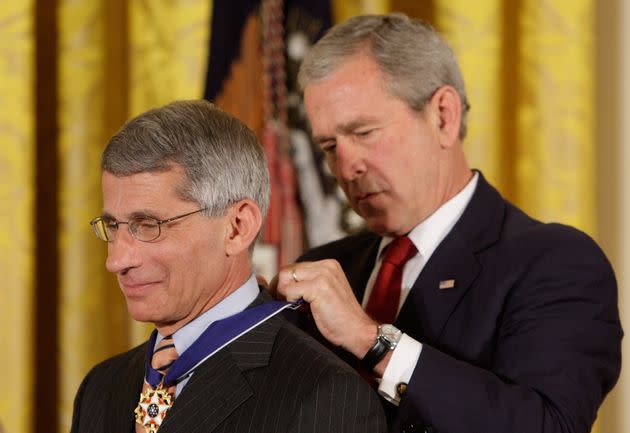 President George W. Bush places the Presidential Medal of Freedom on Dr. Anthony Fauci in 2008. (Photo: via Associated Press)