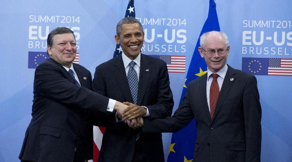 In this March 26, 2014, photo, U.S. President Barack Obama, center, shakes hands with EU Council President Herman Van Rompuy, right, and EU Commission President Jose Manuel Barroso, left, prior to an EU-US summit meeting at the EU Council building in Brussels. From the heart of Europe to the expanse of Saudi Arabia's desert, Obama's weeklong overseas trip amounted to a reassurance tour for stalwart, but sometimes skeptical, American allies. At a time when Obama is grappling with crises and conflict in both Europe and the Middle East, the four-country swing also served as a reminder that even those longtime partners still need some personal attention from the president. (AP Photo/Virginia Mayo)