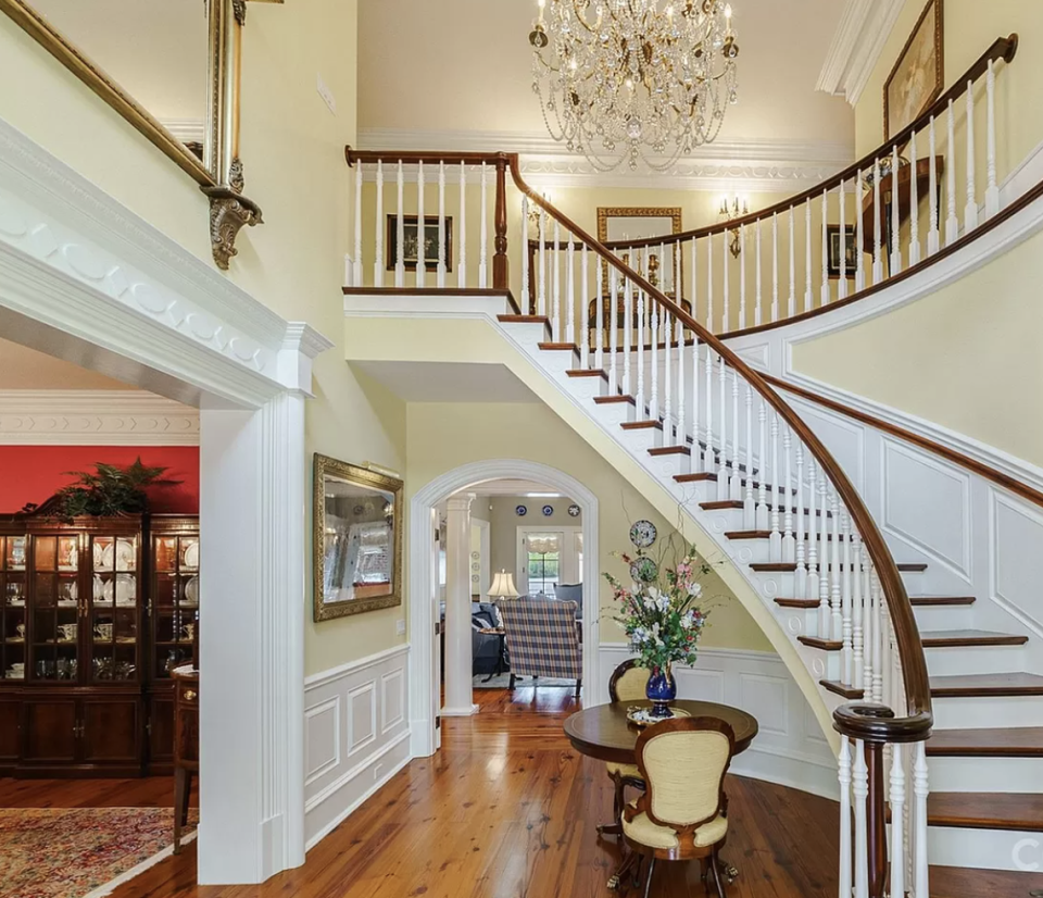 An antique chandelier is at the top of the staircase. Premier Sotheby's/provided