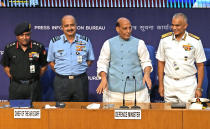 From left, Indian Army chief General Manoj Pande, Indian Air Force Chief Air Chief Marshal V R Chaudhari, Indian Defence Minister Rajnath Singh and Indian Naval Chief Admiral R. Hari Kumar stand for photographs after the launch of Agnipath Scheme, in New Delhi, Tuesday, June 14, 2022. The Agnipath is a merit based recruitment scheme for enrolling soldiers, airmen and sailors. The Scheme provides an opportunity for the youth to serve in the regular cadre of the armed forces for a duration of four years. (AP Photo/Manish Swarup)
