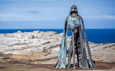 The carving at the opening of Merlin’s Cave, an 8ft bronze sculpture named after the Cornish word for power - Credit: Getty Images