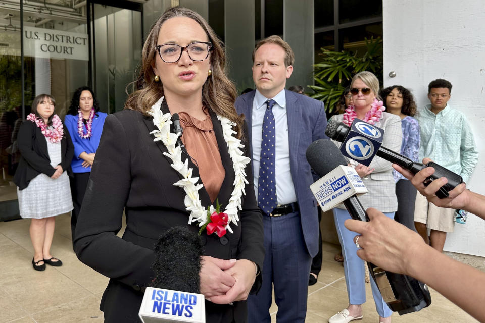Attorney Kristina Baehr speaks to reporters outside federal court on Monday, May 13, 2024, in Honolulu. Baehr represents U.S. military families suing the United States over a 2021 jet fuel leak into a Navy water system in Hawaii that sickened thousands of people. (AP Photo/Jennifer Kelleher)