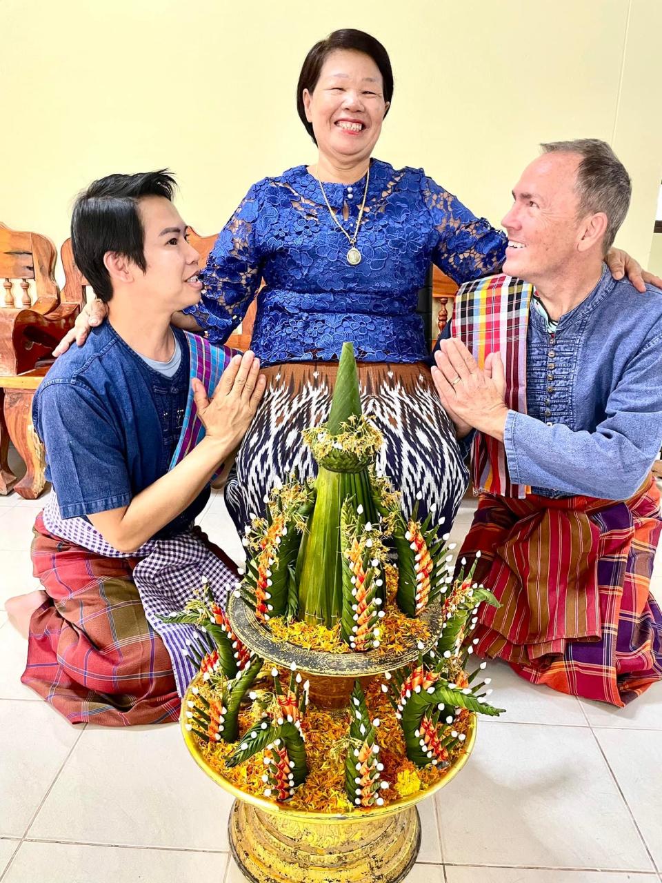 Malakor restaurant owners Noopy Areerak, left, and Billy Manthy, right, honor Areerak's mother Chanton Areerak in Yasothon, Thailand.