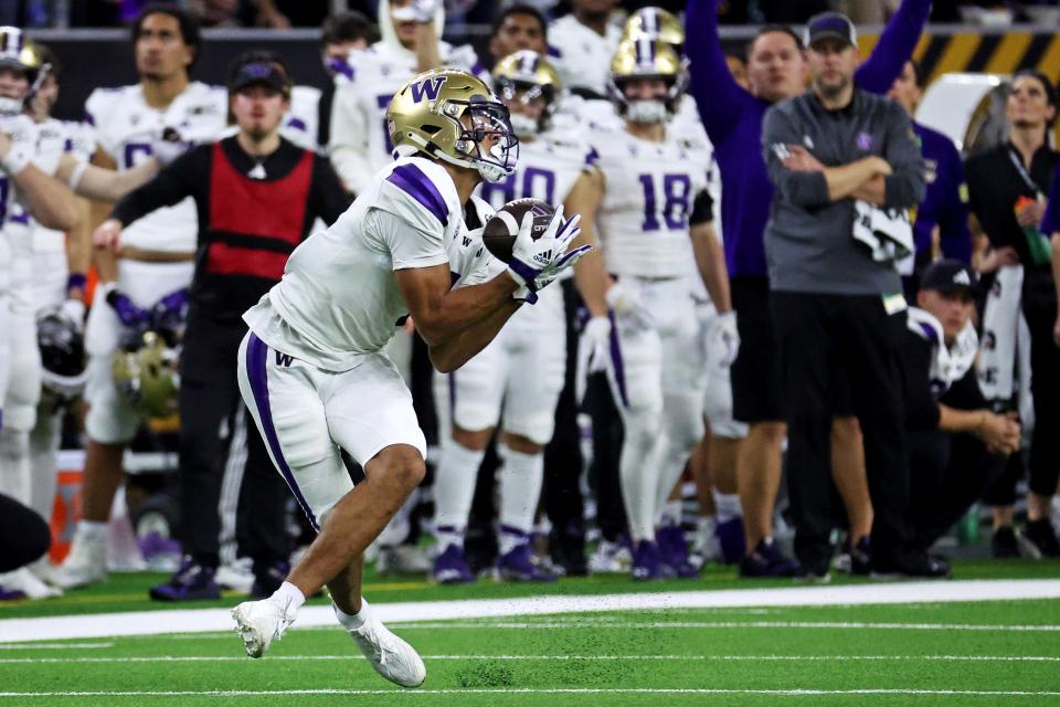 Jan 8, 2024; Houston, TX, USA; Washington Huskies wide receiver <a class="link " href="https://sports.yahoo.com/ncaaf/players/311565/" data-i13n="sec:content-canvas;subsec:anchor_text;elm:context_link" data-ylk="slk:Rome Odunze;sec:content-canvas;subsec:anchor_text;elm:context_link;itc:0">Rome Odunze</a> (1) makes a catch during the fourth quarter against the Michigan Wolverines in the 2024 College Football Playoff national championship game at NRG Stadium. Mandatory Credit: Troy Taormina-USA TODAY Sports
