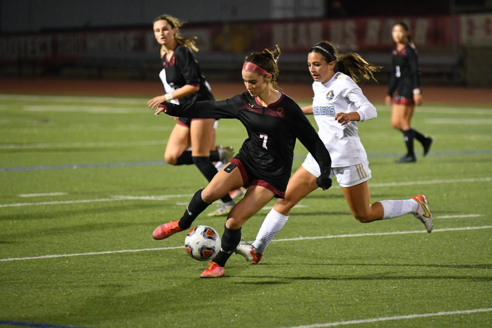 Oaks Christian's Charlotte Ward controls the ball during the Lions' state regional playoff game against visiting Los Osos on Thursday. Oaks Christian lost in a penalty-kick shootout after finishing regulation and overtime scoreless.