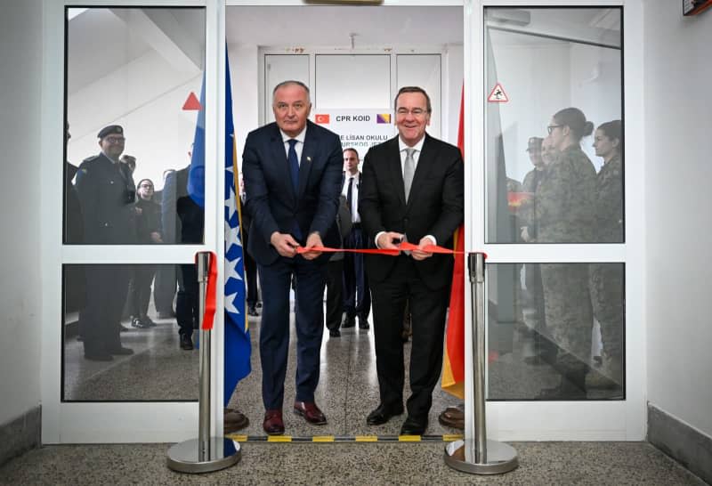 Boris Pistorius (R), Germany's Defence Minister, opens the German language laboratory at the language school in the Rajlovac barracks together with Zukan Helez (L), Bosnia-Herzegovina's Defence Minister, during his three-day trip to the Balkans. Soeren Stache/dpa