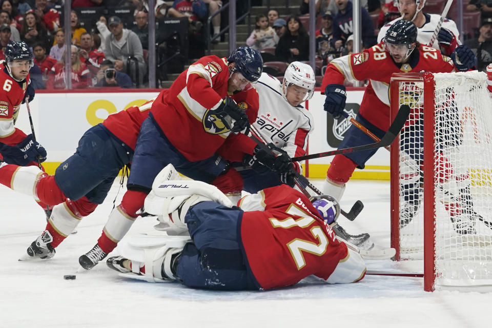 Florida Panthers goaltender Sergei Bobrovsky (72) stops a shot on goal by Washington Capitals center Joe Snively (91) during the first period of an NHL hockey game, Tuesday, Nov. 15, 2022, in Sunrise, Fla. (AP Photo/Marta Lavandier)