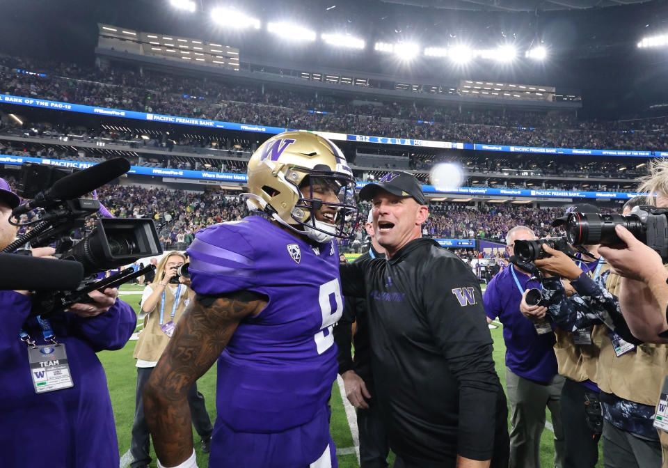 LAS VEGAS, NV - DECEMBER 01: Washington Huskies head coach Kalen DeBoer and quarterback Michael Penix Jr. (9) meet on the field at the conclusion of the PAC-12 Championship Game between the Oregon Ducks and the Washington Huskies Friday, Dec. 1, 2023, at Allegiant Stadium in Las Vegas, Nevada. (Photo by Marc Sanchez/Icon Sportswire via Getty Images)