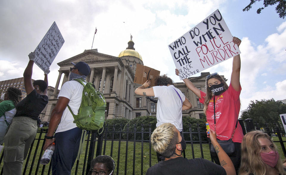 Demonstrators participate in the NAACP March to the Capitol in Atlanta on Monday, June 15, 2020, which coincided with the restart of the Georgia 2020 General Assembly. Lawmakers returned wearing masks and followed new rules to restart the session during the pandemic. (Steve Schaefer/Atlanta Journal-Constitution via AP)