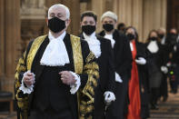 Speaker of The House of Commons Sir Lindsay Hoyle walks through the Central Lobby on the way to the House of Lords prior to Queen Elizabeth II delivering a speech during the State Opening of Parliament in the House of Lords at the Palace of Westminster in London, Tuesday May 11, 2021. (Stefan Rousseau/Pool via AP)