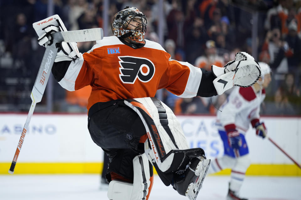 Philadelphia Flyers' Samuel Ersson, left, reacts after blocking a shot by Montreal Canadiens' Jesse Ylonen during a shootout in an NHL hockey game, Wednesday, Jan. 10, 2024, in Philadelphia. (AP Photo/Matt Slocum)