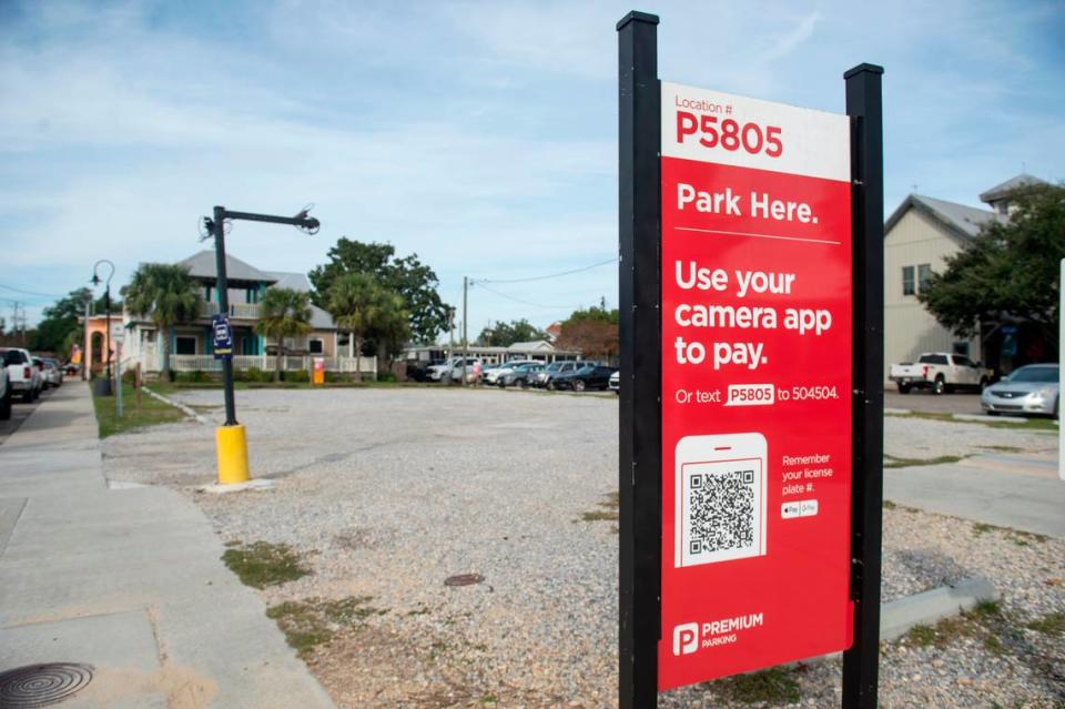 Large and bright signs mark the Premium Parking lots, where people pay to park in busy downtown Bay St. Louis. Signs for the free city parking garage are hard to spot.