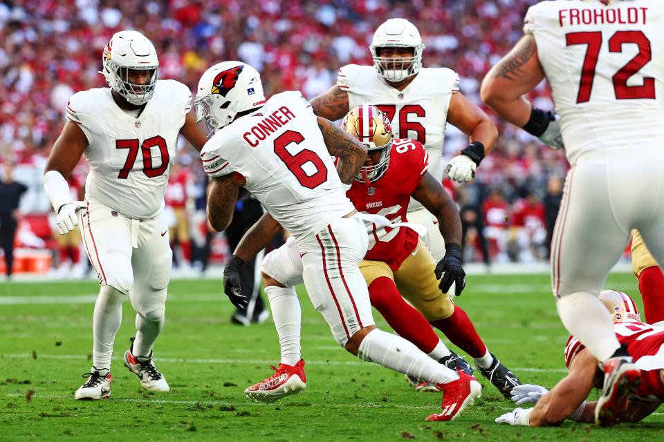 Arizona Cardinals running back James Conner (6) runs for a touchdown during the first quarter against the San Francisco 49ers at State Farm Stadium in Glendale on Dec. 17, 2023.
