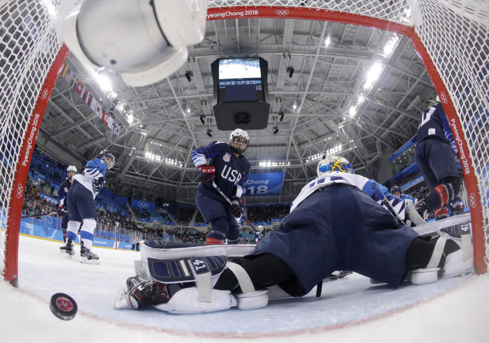 <p>The puck shot by Jocelyne Lamoureux-Davidson, of the United States, sails past goalie Noora Raty (41), of Finland, during the second period of the semifinal round of the women’s hockey game at the 2018 Winter Olympics in Gangneung, South Korea, Monday, Feb. 19, 2018. (Matt Slocum/Pool Photo via AP) </p>