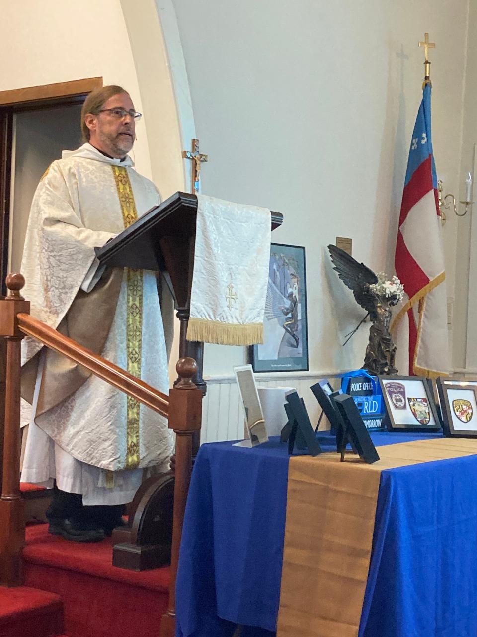 Father Steve McCarty, vicar of St. Andrew's Episcopal Church in Clear Spring, speaks during last week's service to honor area law enforcement officers who died in the line of duty.