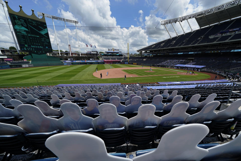 Cutouts of fans fill empty seats in Kauffman Stadium during the fourth inning of a baseball game between the Kansas City Royals and the Chicago White Sox Sunday, Aug. 2, 2020, in Kansas City, Mo. (AP Photo/Charlie Riedel)