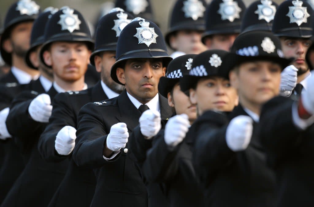 Metropolitan Police officers parade (PA) (PA Archive)