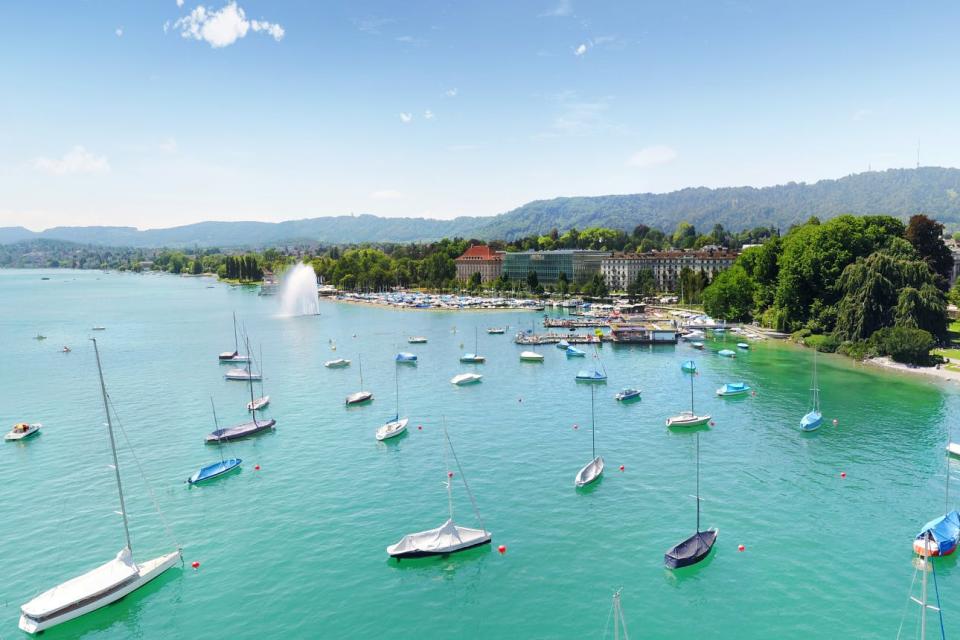 The harbor of Lake Zurich in summer is a bright turquoise