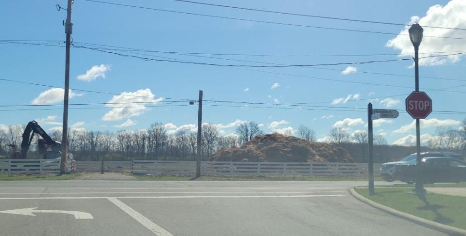 A view looking east from Market Street in New Albany toward its intersection with Reynoldsburg-New Albany Road. New Albany officials plan to build an estimated $14-million roundabout at the intersection and extension of Market Street to the northeast to connect to 3rd Street at East Dublin Grainville Road beginning this fall. Trees on the east side of Reynoldsburg-New Albany Road were recently removed and replaced by the large mulch pile see in the photo.