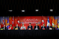 Canada's Prime Minister Justin Trudeau (C) speaks during the closing news conference at the First Ministers’ meeting in Ottawa, Ontario, Canada, December 9, 2016. Also pictured are (L-R) Saskatchewan Premier Brad Wall, British Columbia Premier Christy Clark, New Brunswick Premier Brian Gallant, Ontario Premier Kathleen Wynne, Nova Scotia Premier Stephen McNeil, Manitoba Premier Brian Pallister, Prince Edward Island Premier Wade MacLauchlan and Alberta Premier Rachel Notley. REUTERS/Chris Wattie