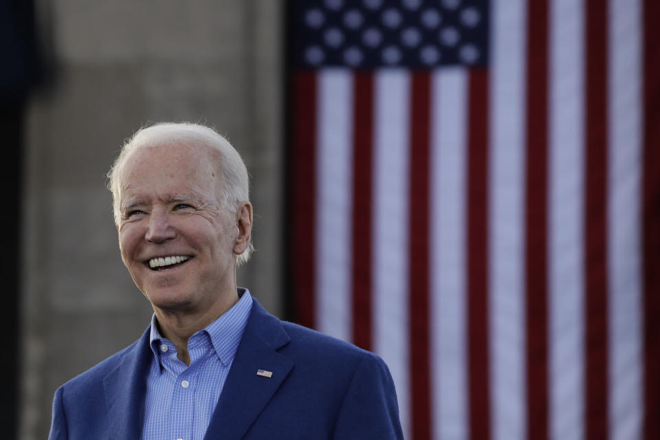 FILE - In this March 7, 2020, file photo Democratic presidential candidate former Vice President Joe Biden acknowledges the crowd during a campaign rally in Kansas City, Mo. In an effort to ease concerns about his age, the 77-year-old presumptive Democratic nominee has said he wouldn't seek reelection if his mental or physical health declined. He has also referred to himself as a “transition candidate," acting as a bridge to a younger generation of leadership. (AP Photo/Charlie Riedel, File)