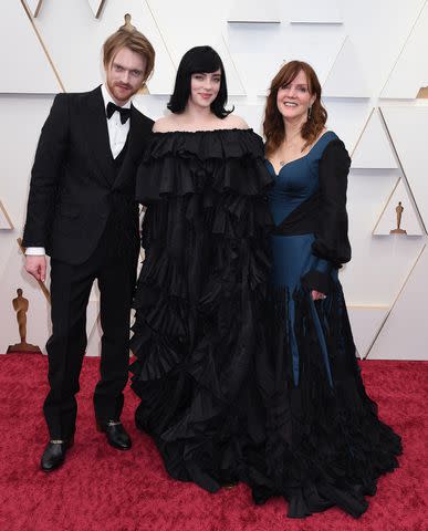 <p>Gilbert Flores/Variety/Penske Media via Getty</p> FINNEAS, Billie Eilish and their mother Maggie Baird at the Academy Awards in March 2022 in Los Angeles