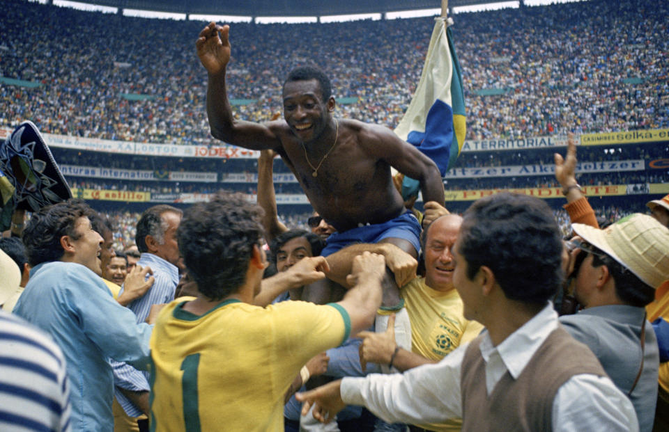 FILE - Brazil's Pele is hoisted on the shoulders of his teammates after Brazil won the World Cup final against Italy, 4-1, in Mexico City's Estadio Azteca, June 21, 1970. A Brazilian dictionary has added “Pelé” as an adjective to use when describing someone who is “exceptional, incomparable, unique.” The announcement by the Michaelis dictionary on Wednesday, April 26, 2023, is part of a campaign that gathered more than 125,000 signatures to honor the late soccer great’s impact beyond his sport. (AP Photo, File)