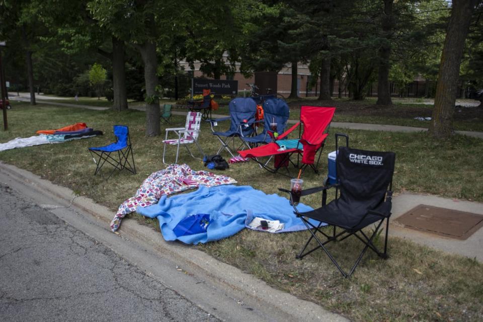 <div class="inline-image__caption"><p>Chairs and blankets are left abandoned at the Highland Park parade route.</p></div> <div class="inline-image__credit">Jim Vondruska/Getty</div>