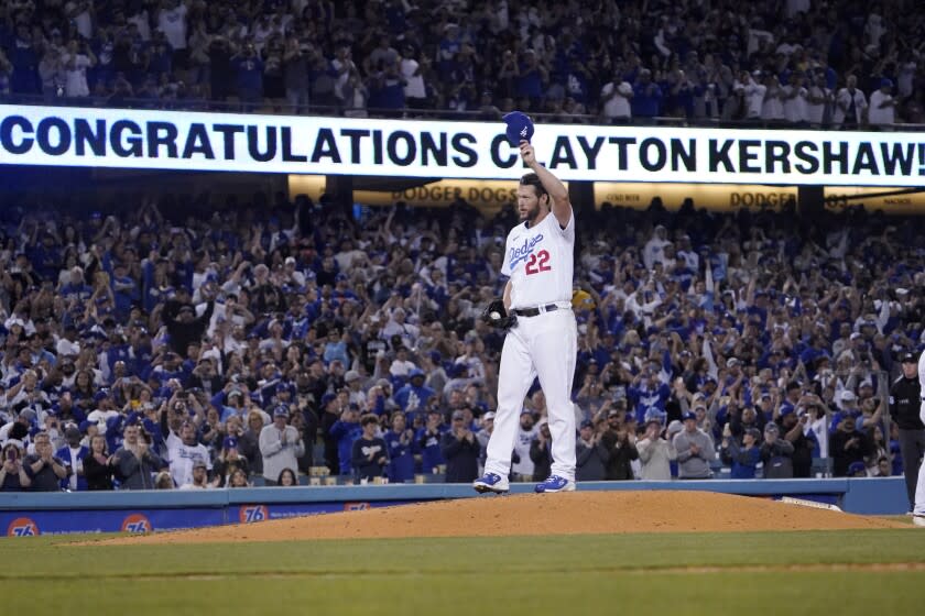 Los Angeles Dodgers starting pitcher Clayton Kershaw tips his cap after striking out Detroit Tigers' Spencer Torkelson to pass Don Sutton for Dodgers the all-time strikeouts record during the fourth inning of a baseball game Saturday, April 30, 2022, in Los Angeles. (AP Photo/Mark J. Terrill)