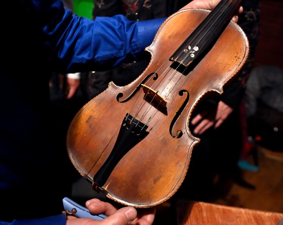 A violin originally played at the 1895 Texas Cowboy’s Christmas Ball, brought to the Dec.14 reenactment by Hunter Johnson, a descendant of the instrument's first owner.