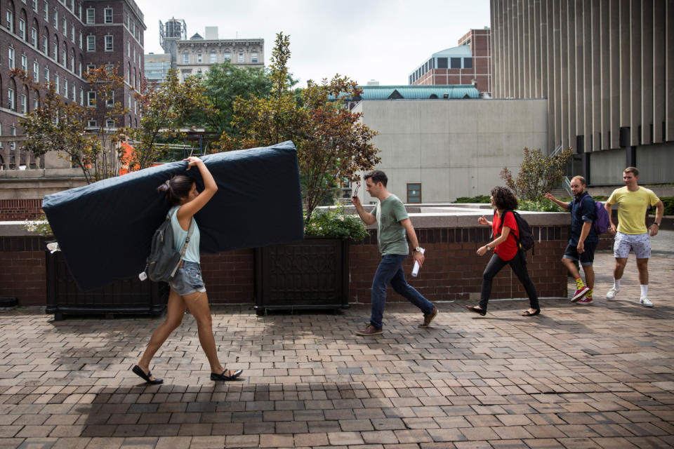 <p>Emma Sulkowicz, a senior visual arts student at Columbia University, carries a mattress in protest of the university’s lack of action after she reported being raped during her sophomore year on September 5, 2014 in New York City. Sulkowicz has said she is committed to carrying the mattress everywhere she goes until the university expels the rapist or he leaves. The protest is also doubling as her senior thesis project.</p>