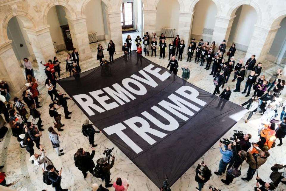 Protesters inside the Senate building call for Donald Trump’s removal.