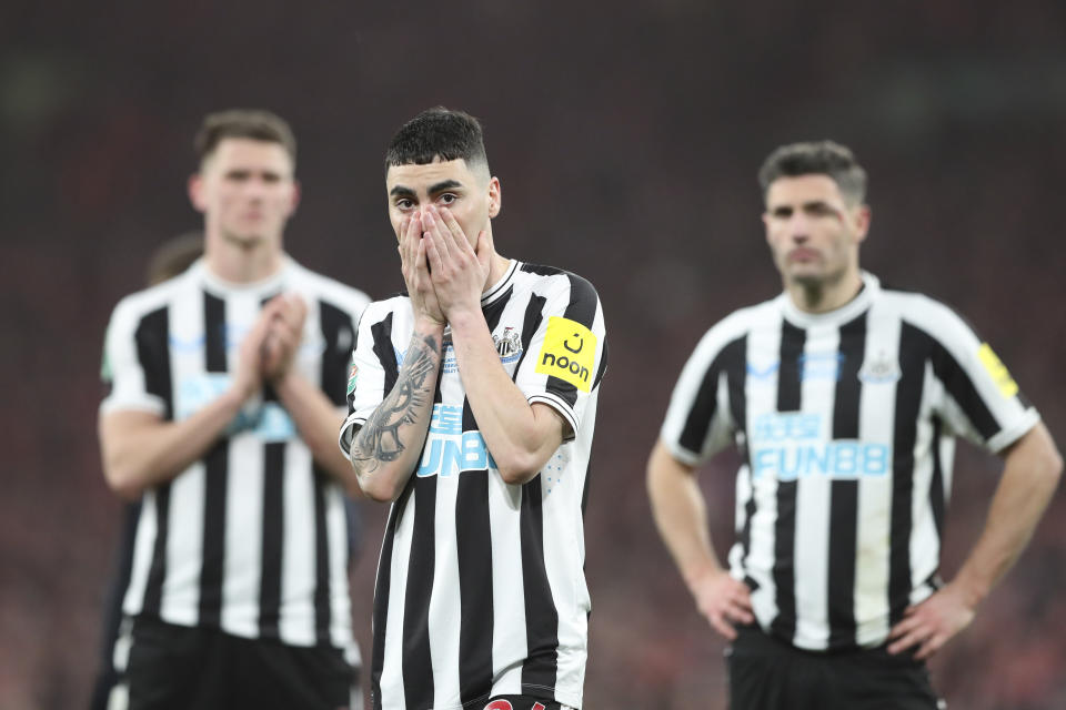 Newcastle's Miguel Almiron, centre, Newcastle's Fabian Schaer, right, and Newcastle's Sven Botman gesture after loosing the English League Cup final soccer match between Manchester United and Newcastle United at Wembley Stadium in London, Sunday, Feb. 26, 2023. Manchester United won 2-0. (AP Photo/Scott Heppell)