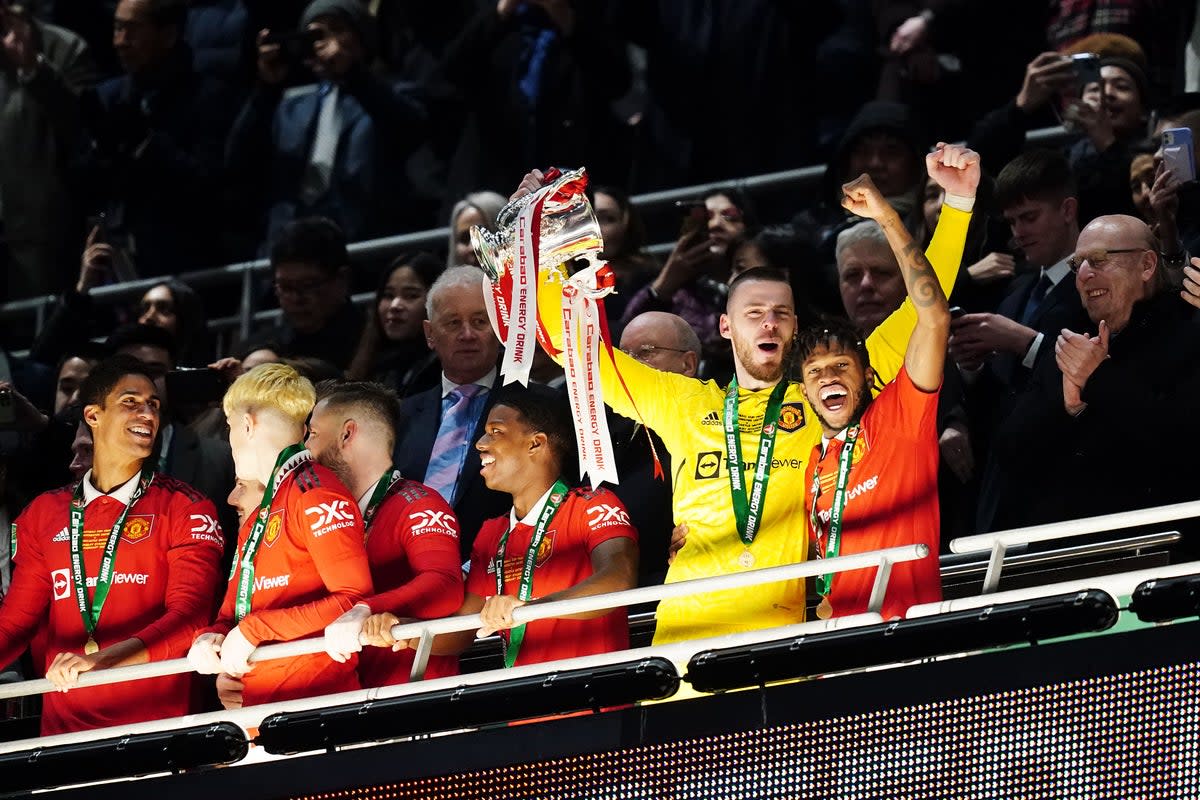 David de Gea (left) and Fred celebrate with the trophy (David Davies/PA) (PA Wire)