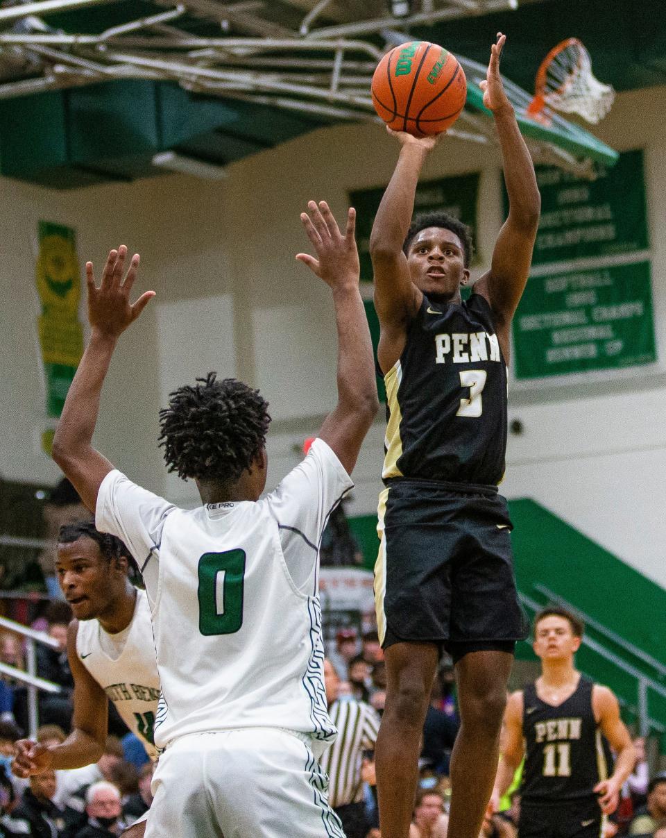 Penn's Markus Burton (3) shoots during the Penn vs. Washington boys basketball game Friday, Feb. 11, 2022 at Washington High School. 