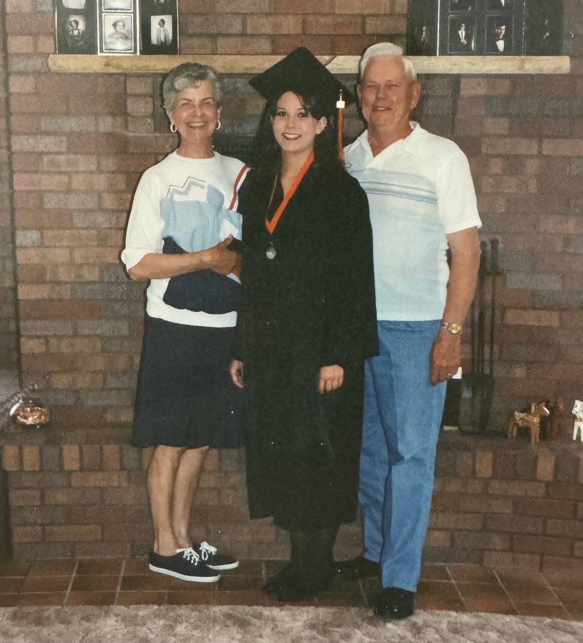 Katie Grover, center, is pictured after her high school graduation with her maternal grandmother, Genevieve Slack Meditz, and grandfather, Lloyd Meditz. Genevieve, who died in 2013, insisted that Katie learn as a young woman to make her famous povitica. Courtesy/Katie Grover