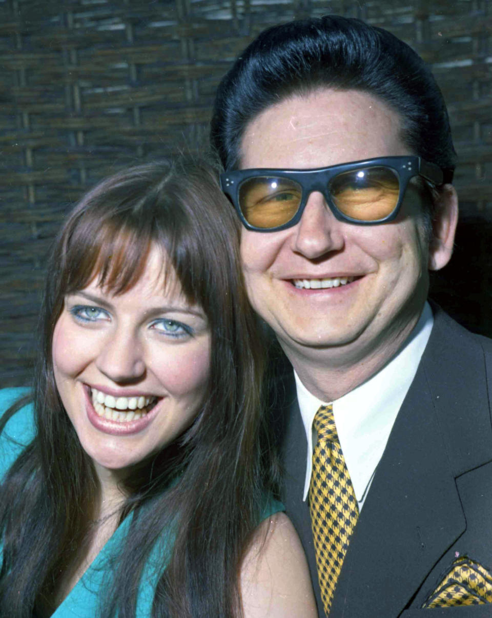 FILE - In this April 1, 1969 file photo, American pop singer Roy Orbison poses with his then 18-year-old wife Barbara to the media in London. Orbison's three sons, Wesley, Roy Jr. and Alex Orbison have helped create a new song by their father that will appear on the 25th anniversary reissue and expansion of Orbison's final album, "Mystery Girl" that is being re-released on May 20, 2014. His wife, Barbara, acted as his manager at the time he first released "Mystery Girl," and even sang backup on the album. (AP Photo/Bob Dear, File)