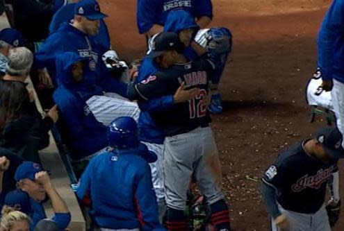 Indians shortstop Francisco Lindor hugs Cubs reliever Hector Rondon during the third inning of World Series Game 4. (MLB)