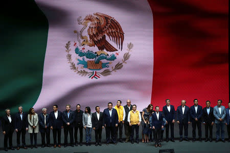 Ricardo Anaya, accompanied by his family and members of the parties that take part of the left-right coalition, looks on after being sworn-in as presidential candidate of the National Action Party (PAN) at the Auditorio Nacional in Mexico City, Mexico February 18, 2018. REUTERS/Edgard Garrido