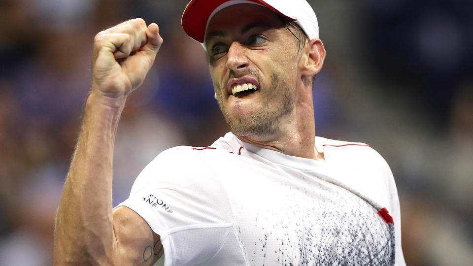 John Millman celebrates a point during his men’s singles quarter-final match against Novak Djokovic. (Photo by Matthew Stockman/Getty Images)